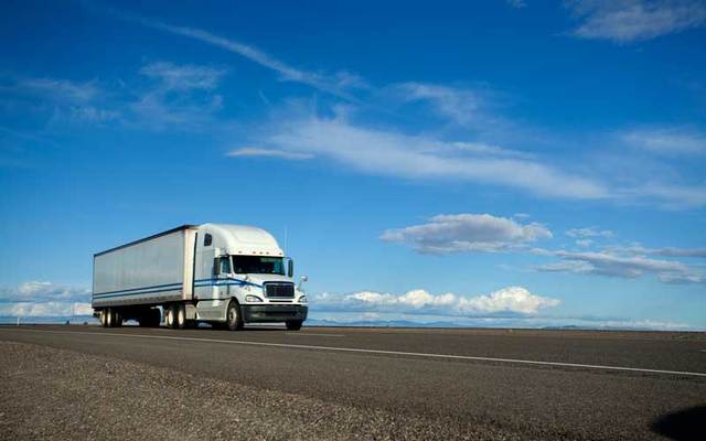 A semi truck on the open road.