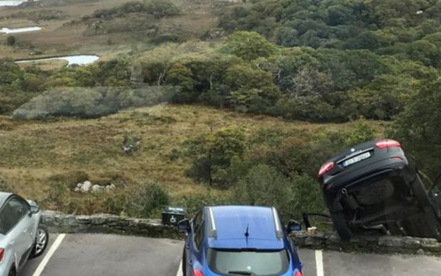 A car dangles precariously over the Ladies View lookout point in Killarney 