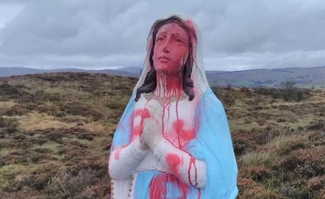 The still unidentified vandals daubed the word ‘whore’ in red paint across the front of the eight foot statue of the Virgin Mary. 