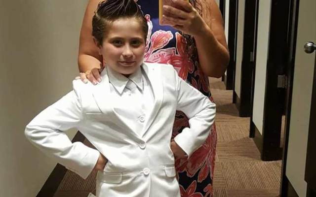 Cady Mansell, nine, in the white suit she chose for her First Communion. 