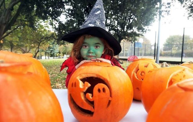 A child dressed as a witch at the Pumpkin Party in Markievicz Park, Ballyfermot, Dublin in 2018.