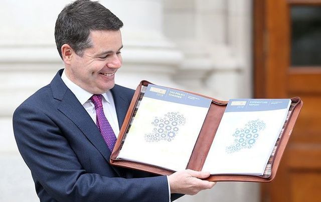Ireland\'s Minister for Finance Paschal Donohue poses with Ireland\'s 2018 Budget.