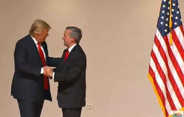 Trump shaking hands with Dr. Robert Jeffress
