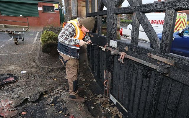 Repairs being carried out on the cemetery gates after the were set on fore over the weekend. 