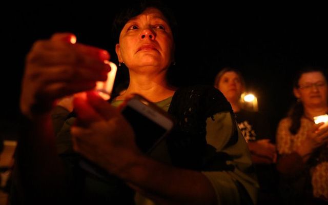 A candle-lit vigil to remember the 28 people killed by an ex-airforce man who should not have had access to guns.