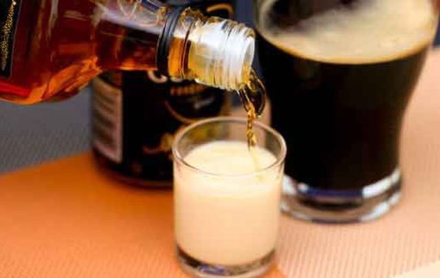 The Irish Car Bomb shot or Irish Bomb shot is generally made by dropping a shot glass of half Baileys/half whisky into half a pint of Guinness. 