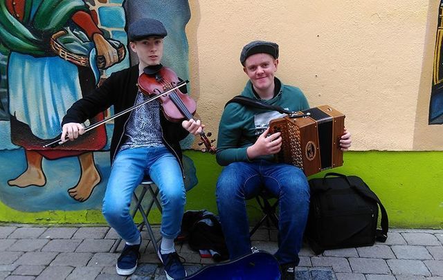 Young men from Tipperary belting out the Irish tunes while busking in Galway.