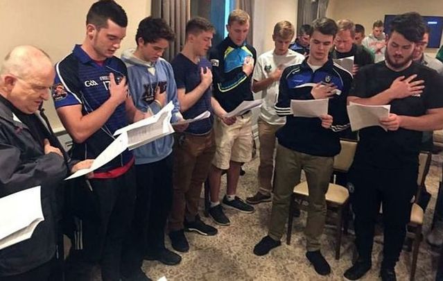 Sean Brewer, at the back center, swearing an oath to the AOH.