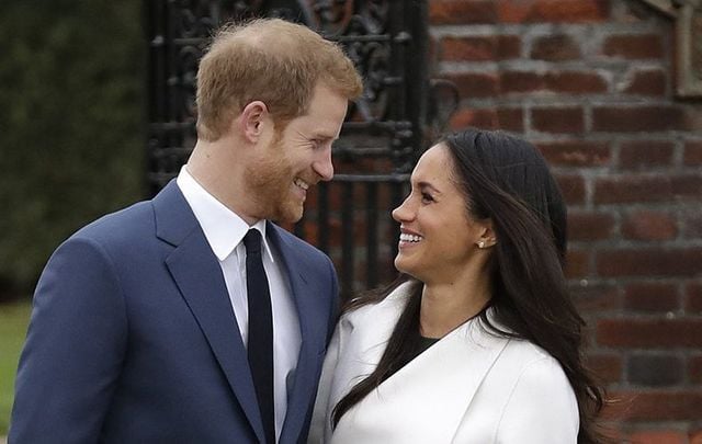 Prince Harry and Meghan Markle pose for the media after officially announcing their engagement.