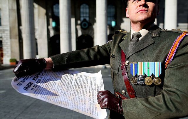 Captain Peter Kelleher from the 27th Infantry Battalion reads the Proclamation at the GPO on O\'Connell Street on March 27, 2016, in Dublin, Ireland.