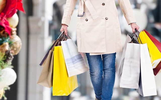 Christmas shopper with several shopping bags.