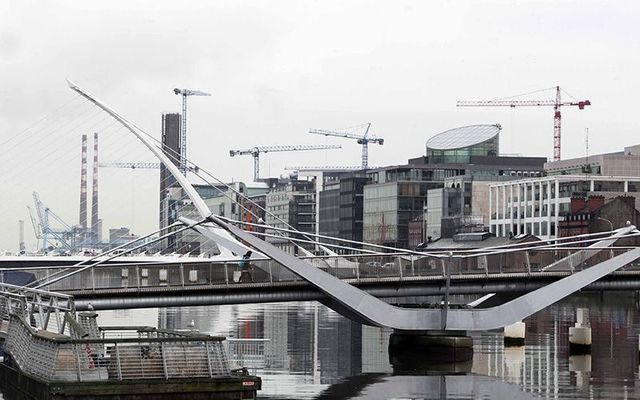 Cranes rise over Dublin\'s Silicon Docks.