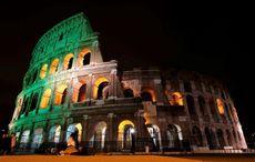 How are the landmarks that light up green for St. Patrick's Day linked to Ireland?