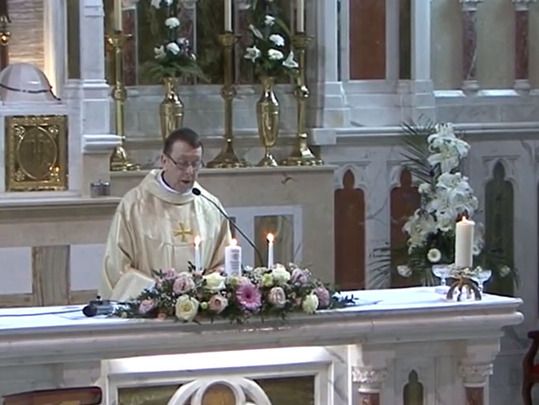 Irish priest Father Ray Kelly at Chris and Leah O\'Kane\'s wedding in 2014.