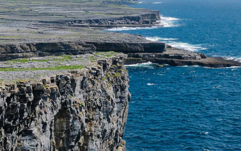 Part of the famous Inishmore Aran Island cliff falls into the sea