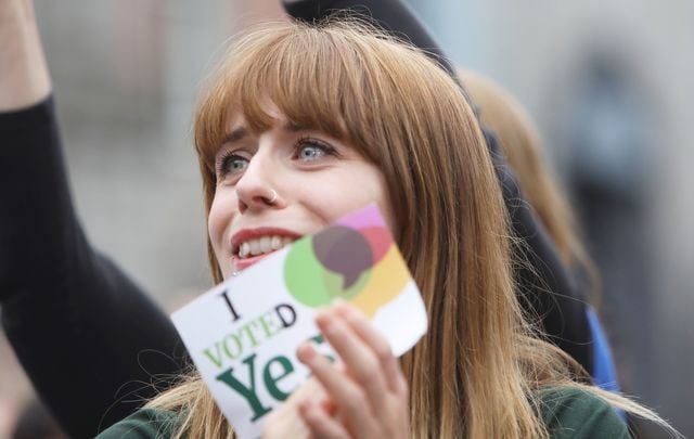 Women rejoice at a vote counting center on Saturday in Dublin.