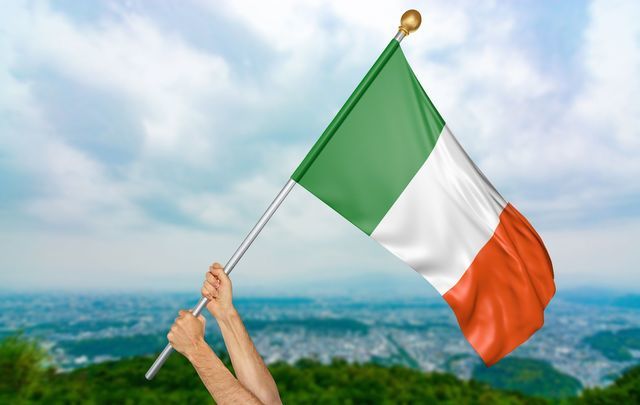 Someone proudly holding up the Irish flag.