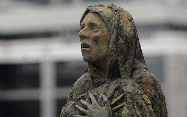 The horror of a Great Hunger victim\'s face - The Famine Memorial on Dublin\'s Liffey quays.