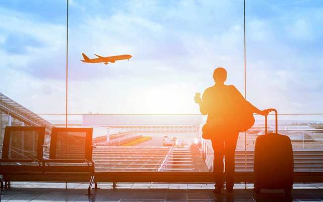 Traveler waiting for a flight.