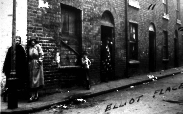 Women standing on the street corner of Elliot Place, in Monto, Dublin.