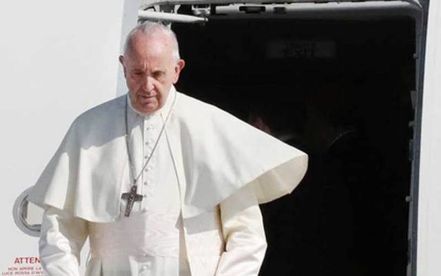 Pope Francis disembarks from his plane at Dublin Airport on the first day of his Ireland visit.