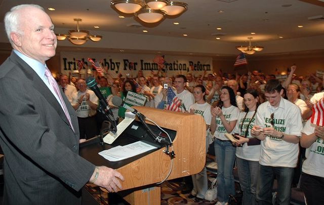 Senator McCain standing before crowds supporting the Irish Lobby for Immigration Reform (ILIR) at St. Barnabas Church in the Bronx for an April 2006 rally.