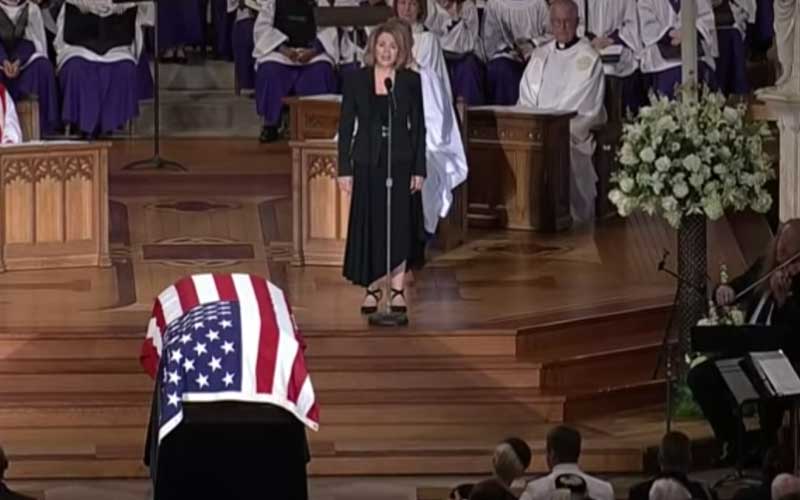 Cindy McCain weeps during “Danny Boy” as her son comforts her at funeral