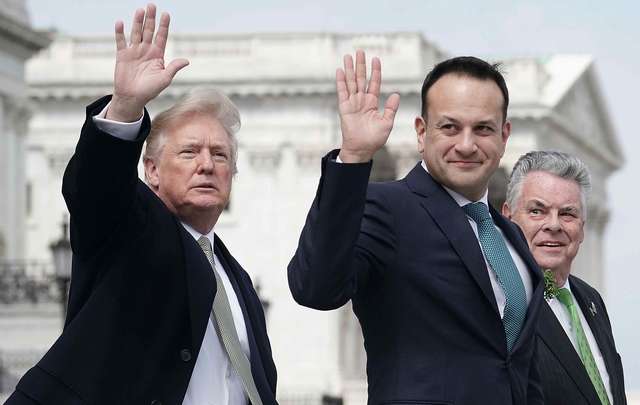 U.S. President Donald Trump (L) and Irish Taoiseach Leo Varadkar (2nd L) wave as U.S. Rep. Peter King (R-NY) (R) looks on after the Friends of Ireland luncheon March 15, 2018, on Capitol Hill in Washington, DC. 
