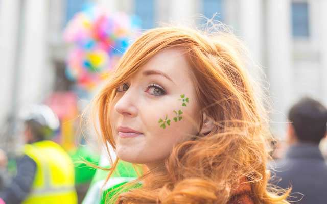 Irish girl enjoying the parade, Dame Street, Dublin, Ireland.