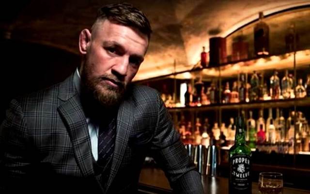Conor McGregor with his whiskey Proper No.Twelve.