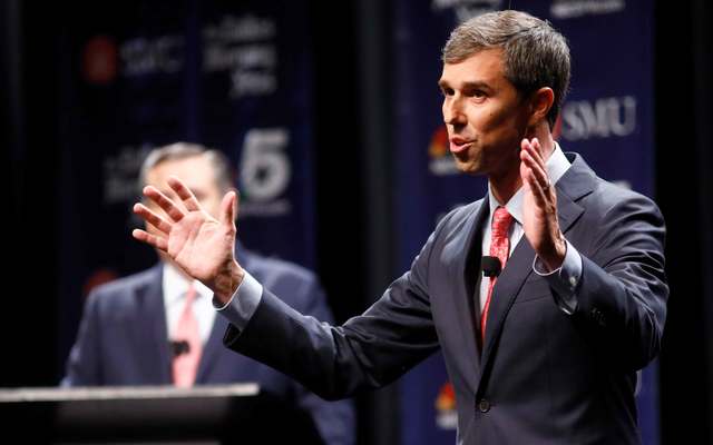 Rep. Beto O\'Rourke (D-TX) makes his final remarks as Sen. Ted Cruz (R-TX) listens during a debate at McFarlin Auditorium at SMU on September 21, 2018, in Dallas, Texas. 