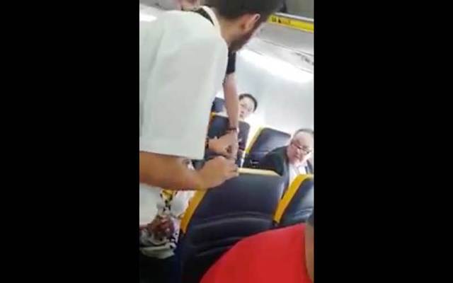 Caught on video: A Ryanair passenger launches a tirade of racial abuse towards an elderly black woman and was not removed from the flight.