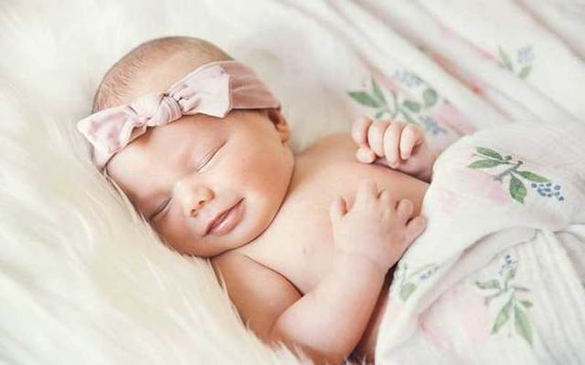 A newborn baby girl.