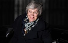 Theresa May to continue leading Britain through Brexit, wins confidence vote