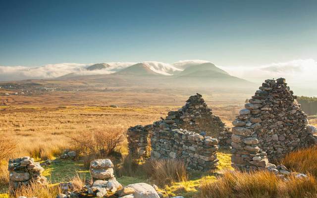 Old ruined stone cottage overlooks the Renvyle Peninsula in Connemara, West of Ireland. 