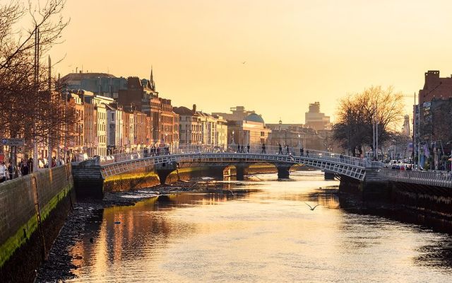 The Ha\' Penny Bridge, over the River Liffey, at the center of Dublin city. 