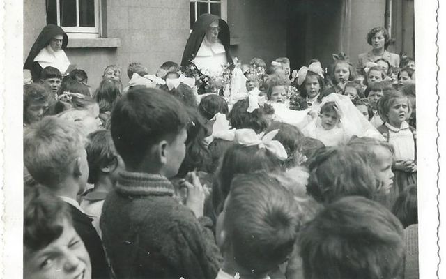 Catholic nuns running Jean Farrell\'s own schoolyard on her communion day.