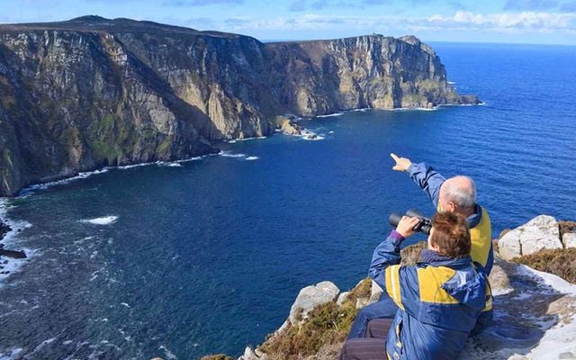 Senior Couple admires a beautiful landscape.Location is Ireland county Donegal