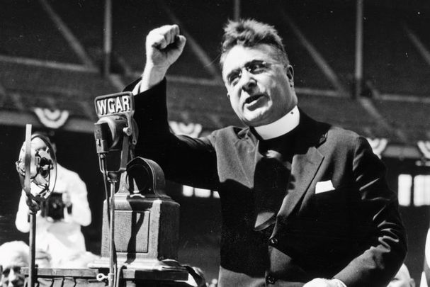 Father Charles Coughlin delivers a radio speech, circa 1930s.