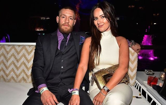 Mixed martial artist Conor McGregor (L) and Dee Devlin attend his birthday celebration at Intrigue Nightclub at Wynn Las Vegas early July 10, 2016, in Las Vegas, Nevada.