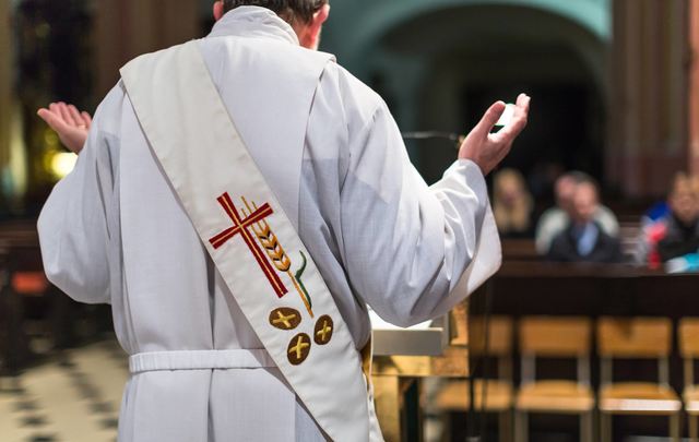 Priest saying mass. 