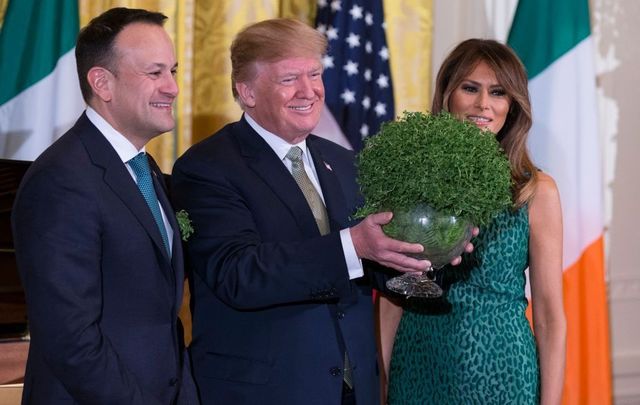 Prime Minister Leo Varadkar of Ireland, United States President Donald J. Trump, and first lady Melania Trump pose with a bowl of shamrocks presented by Varadkar to Trump during the Shamrock Bowl Presentation at the White House on March 15, 2018, in Washington, D.C. 