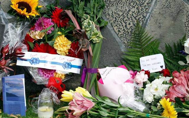 Flowers with messages for the victims of the mosque attacks are seen at the Botanical Garden in Christchurch on Saturday, March 16.