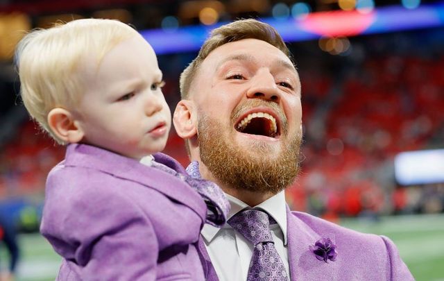 Conor McGregor with his son, Conor Jack McGregor Jr., on the field prior to Super Bowl LIII at Mercedes-Benz Stadium on February 3, 2019, in Atlanta, Georgia.