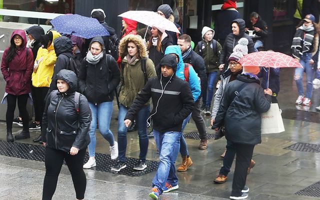 Dubliner braving the elements as the rain pours down. 