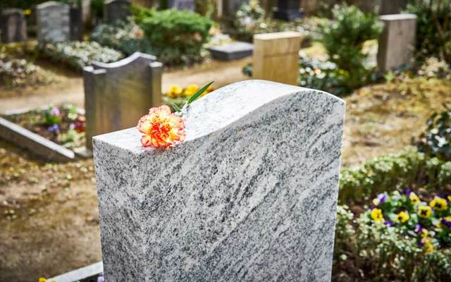 A woman was visiting her parents\' burial plot when she was swallowed by a sinkhole.