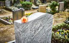 Woman sues cemetery after sinking waist-deep into her parents' grave