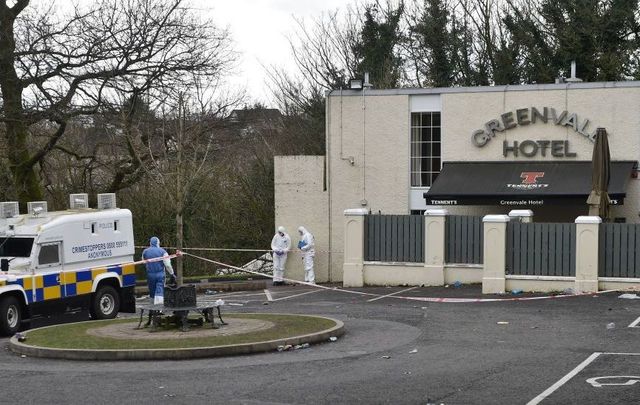 Police forensic officers attend the scene outside the Greenvale Hotel nightclub on March 18, 2019, in Cookstown, Northern Ireland. 