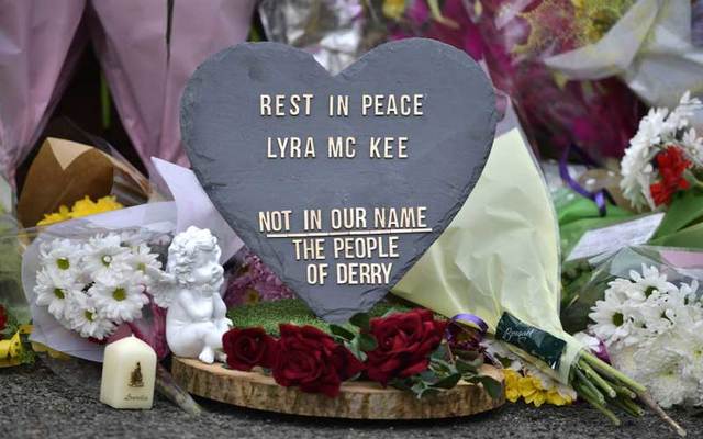 A plaque and flowers left in tribute to journalist Lyra McKee.