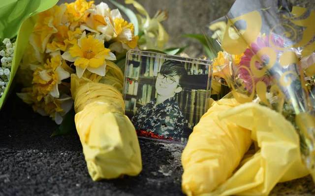 Flowers and photo left in tribute to journalist Lyra McKee near the scene where she was killed on April 19, 2019 in Derry, Northern Ireland. 